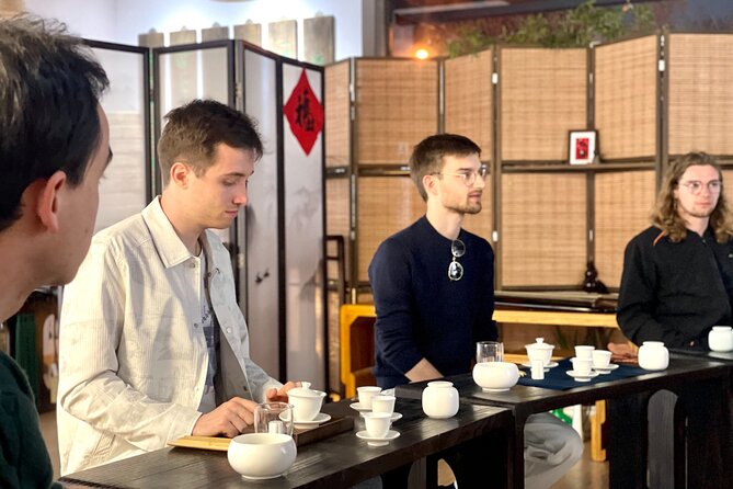 Beijing Culture: Tea Ceremony, Heritage Instrument & Calligraphy - Guqin performance and your own finger work on the strings